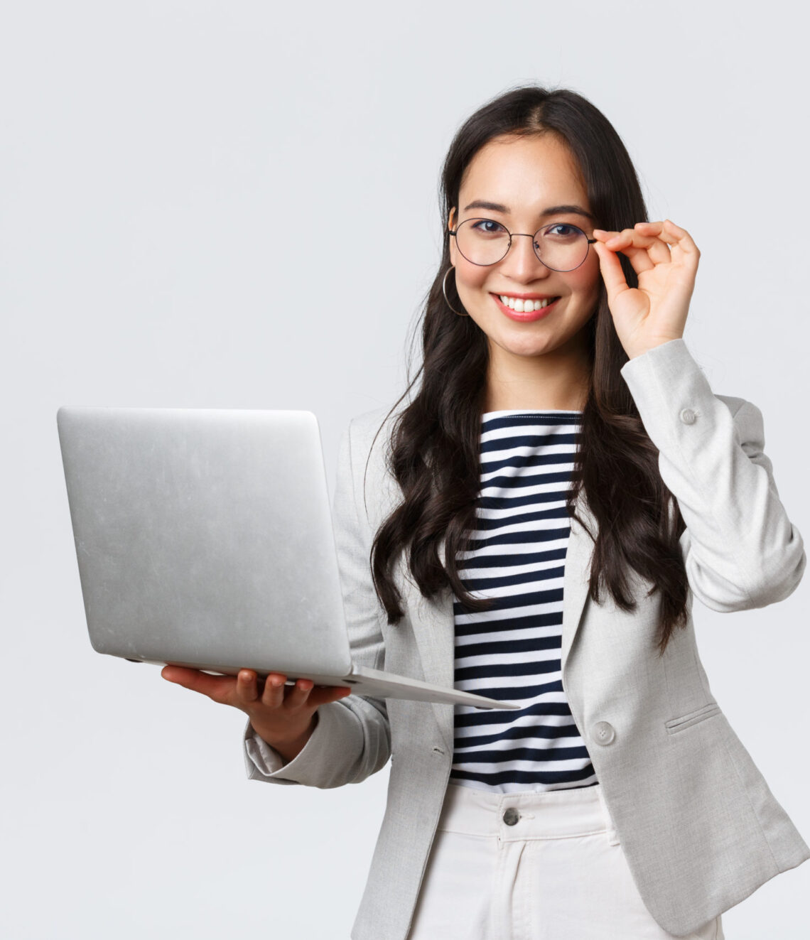 Business, finance and employment, female successful entrepreneurs concept. Confident smiling asian businesswoman, office worker in white suit and glasses using laptop, help clients