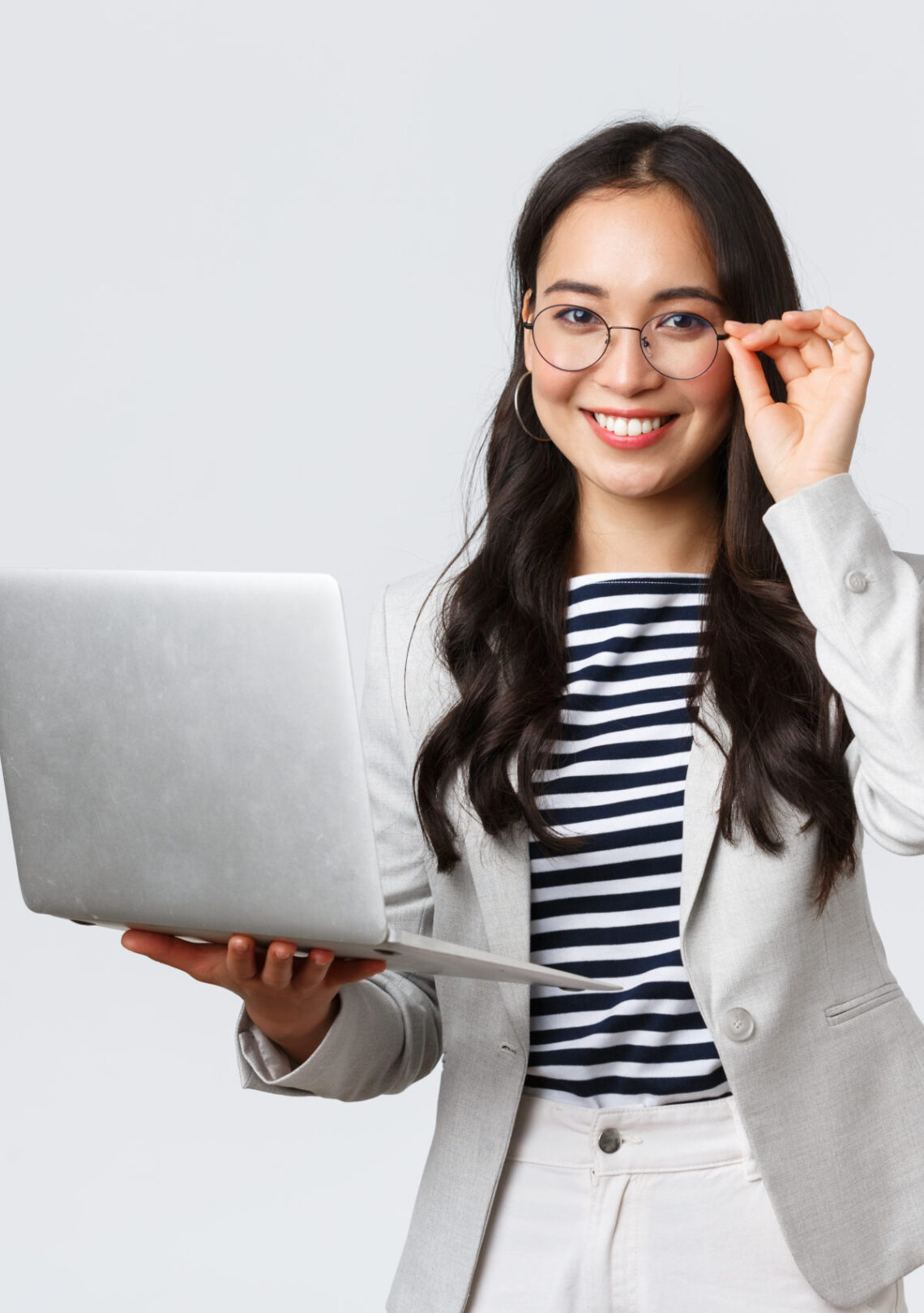 Business, finance and employment, female successful entrepreneurs concept. Confident smiling asian businesswoman, office worker in white suit and glasses using laptop, help clients