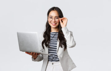 Business, finance and employment, female successful entrepreneurs concept. Confident smiling asian businesswoman, office worker in white suit and glasses using laptop, help clients
