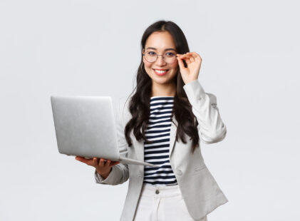 Business, finance and employment, female successful entrepreneurs concept. Confident smiling asian businesswoman, office worker in white suit and glasses using laptop, help clients