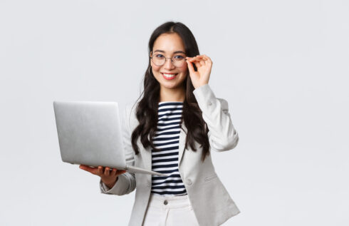 Business, finance and employment, female successful entrepreneurs concept. Confident smiling asian businesswoman, office worker in white suit and glasses using laptop, help clients