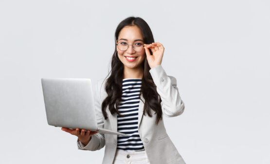 Business, finance and employment, female successful entrepreneurs concept. Confident smiling asian businesswoman, office worker in white suit and glasses using laptop, help clients