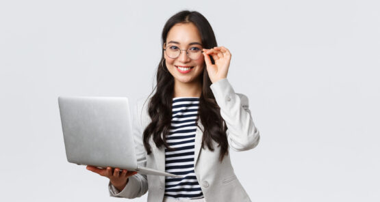 Business, finance and employment, female successful entrepreneurs concept. Confident smiling asian businesswoman, office worker in white suit and glasses using laptop, help clients