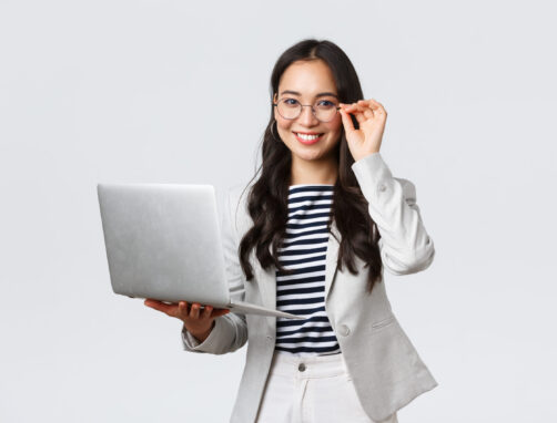 Business, finance and employment, female successful entrepreneurs concept. Confident smiling asian businesswoman, office worker in white suit and glasses using laptop, help clients