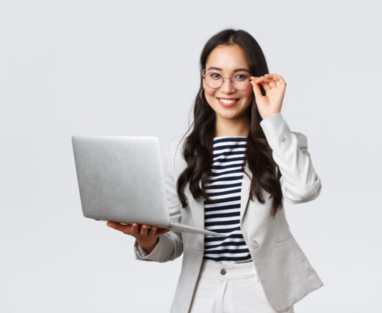 Business, finance and employment, female successful entrepreneurs concept. Confident smiling asian businesswoman, office worker in white suit and glasses using laptop, help clients
